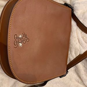 Disney Coach large brown saddle bag
$500